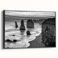Framed canvas wall art showcasing a serene seascape design with vibrant blues and greens, featuring a sleek black frame, perfect for modern decor.