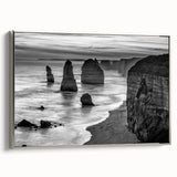 Framed canvas art showcasing a serene seascape with soft waves and a tranquil sky, presented in a sleek silver frame, ideal for coastal-themed decor.