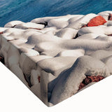 Close-up of a stretched canvas wall art piece showcasing a vibrant seascape design with rich blues and greens, perfect for coastal home decor.