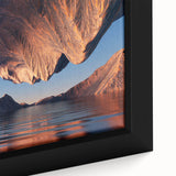 Close-up of a framed canvas showcasing vibrant landscapes and seascapes in a modern design. The artwork features rich colors and intricate details, perfect for home decor.