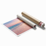 Rolled wall art print showcasing a serene seascape design with vibrant blues and greens, ideal for home decor, packaged securely in a protective tube.