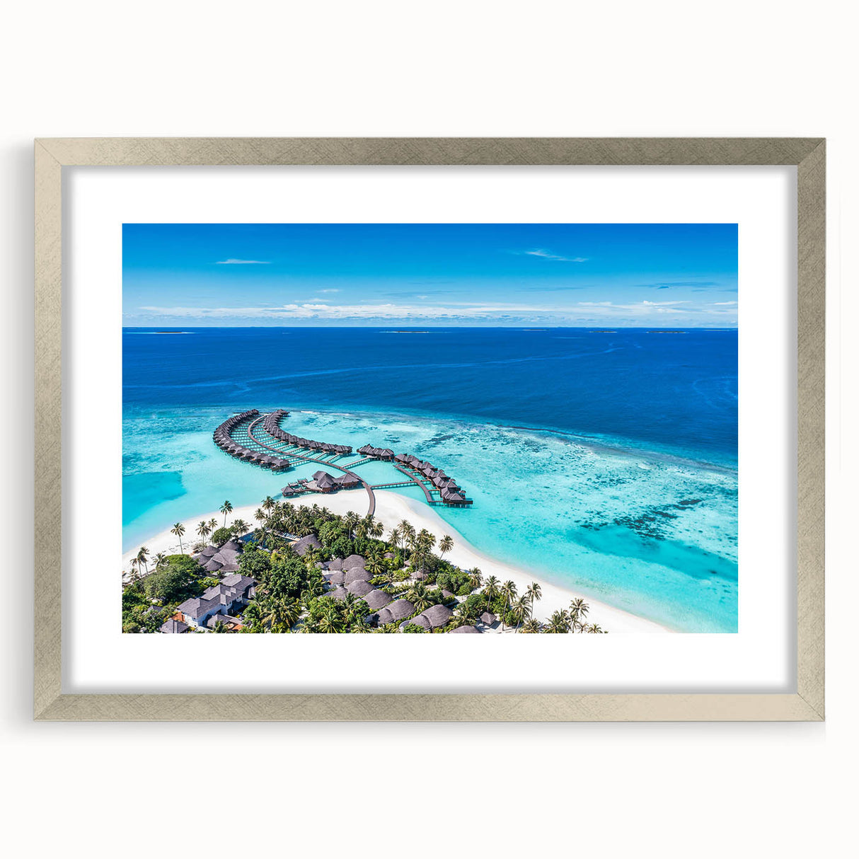 Silver-framed wall art showcasing a serene seascape design, featuring calming blues and soft whites, ideal for enhancing modern home decor aesthetics.