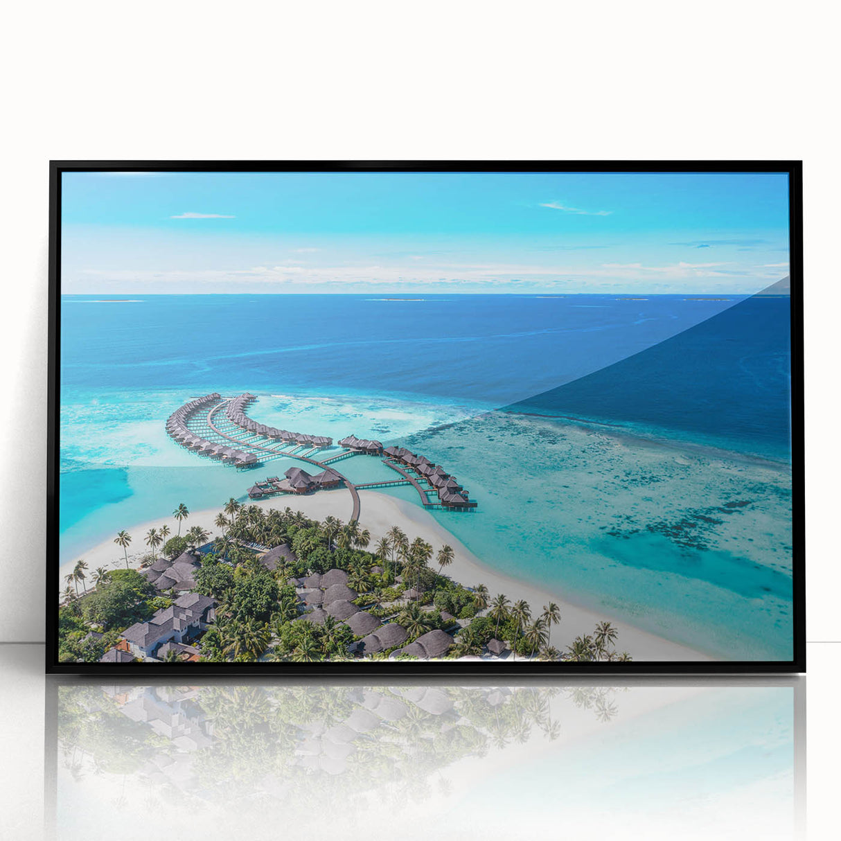 Framed acrylic wall art featuring a serene seascape design with vibrant blue hues, elegantly displayed in a sleek black frame, ideal for modern home decor.