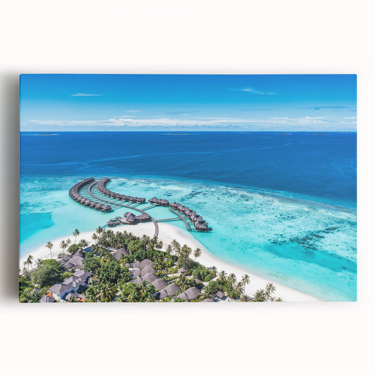 Stretched canvas wall art featuring a serene coastal landscape with vibrant blue ocean waves and a soft sunset sky, ideal for home decor enhancement.