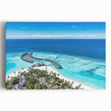 Stretched canvas wall art featuring a serene coastal landscape with vibrant blue ocean waves and a soft sunset sky, ideal for home decor enhancement.