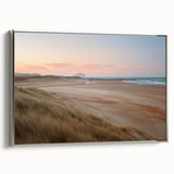 Framed canvas wall art showcasing a serene seascape design with silver accents, highlighting calming blue and green hues, perfect for coastal-themed decor.