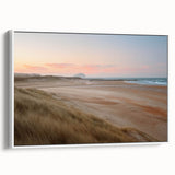 Framed canvas wall art featuring a serene seascape design, showcasing gentle waves and soft pastel colors, perfect for enhancing home decor in coastal themes.