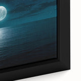 Framed canvas artwork showcasing a serene seascape with vibrant blues and soft whites, emphasizing gentle waves and a tranquil horizon, perfect for coastal decor.