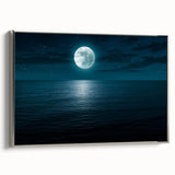 Framed canvas wall art from the Landscapes & Seascapes collection, showcasing serene ocean waves in soft blues and whites, elegantly highlighted with a silver frame.