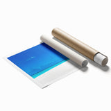 Rolled print of serene seascape wall art design, showcasing vibrant blues and calming waves, packaged securely in a protective cardboard tube for easy transport.
