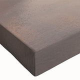 Close-up of a stretched canvas featuring a vibrant seascape design in blue and green hues, depicting waves crashing against rocks, ideal for coastal decor.