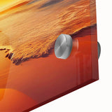 Close-up of a vibrant acrylic glass wall art piece featuring abstract seascape designs in blues and greens, perfect for modern home decor.