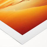 Rolled canvas art showcasing a vibrant seascape design, featuring dynamic waves and a colorful sunset, elegantly packaged in a protective cardboard tube for easy display.