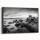 Framed canvas wall art featuring a serene seascape design in vibrant blues and greens, showcasing gentle waves and a tranquil atmosphere. The artwork has a sleek black frame, adding a modern touch suitable for home decor.