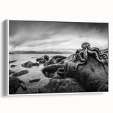 Framed canvas wall art showcasing a serene seascape design with vibrant blues and soft whites, set against a minimalist white frame, ideal for coastal decor.