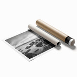 Serene seascape wall art print showcasing tranquil ocean waves and a vibrant sunset, rolled and packaged in a protective tube for easy display.