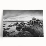 Stretched canvas featuring a serene seascape design, showcasing vibrant blues and soft whites, perfect for coastal-themed decor, leaning against a neutral wall.