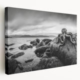 Stretched canvas artwork showcasing a serene seascape design with vibrant blues and soft whites, suitable for modern home decor aesthetics.