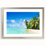 Framed wall art featuring a serene seascape with calming blue tones, elegantly matted in silver, ideal for enhancing modern home decor aesthetics.