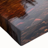 Close-up view of a stretched canvas wall art piece showcasing a vibrant seascape design, featuring rich blues and greens, perfect for coastal-themed decor.