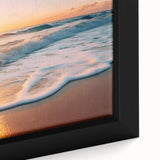 Close-up of a framed canvas artwork showcasing a vibrant seascape design, featuring shades of blue and turquoise, perfect for coastal home decor.