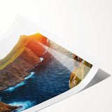 Rolled print of serene coastal landscape artwork showcasing soft blues and vibrant sunset hues, elegantly packaged in protective cardboard tube for display.