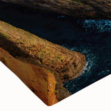 Close-up view of a stretched canvas showcasing a vibrant seascape design with deep blues and greens, perfect for coastal home decor. Ideal for enhancing living spaces.