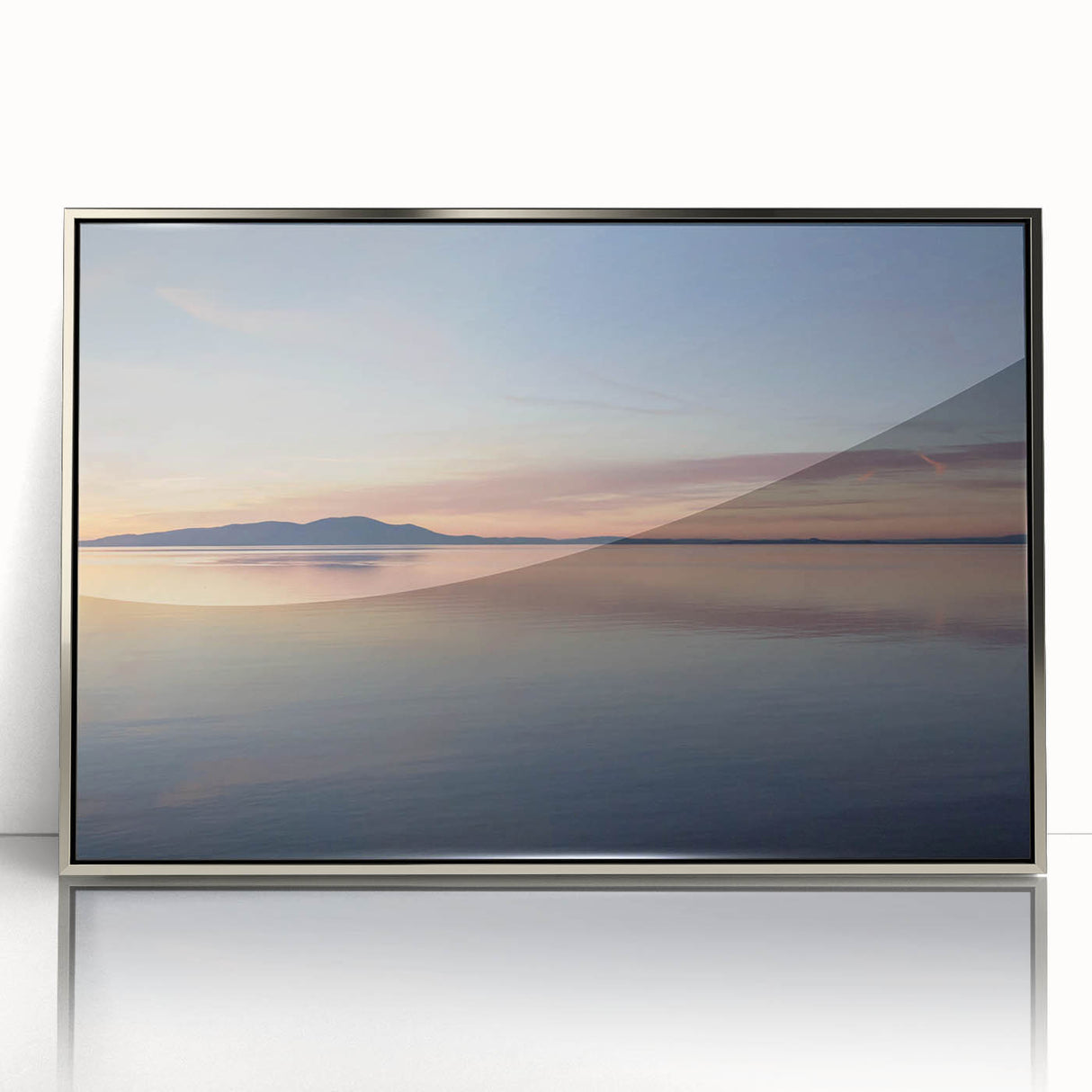 Framed acrylic wall art showcasing a serene seascape design with silver accents, perfect for enhancing modern home decor and creating a tranquil atmosphere.