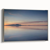 Framed canvas wall art featuring a serene seascape design, elegantly displayed with a silver frame, showcasing calming ocean waves and a tranquil sky. Perfect for enhancing home decor with a touch of coastal elegance.