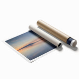 Vibrant seascape wall art print showcasing vivid blues and greens, depicting serene ocean waves and a sunset backdrop, rolled for easy shipping and display.