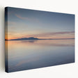 Stretched canvas wall art showcasing a serene seascape design with vibrant blues and soft whites, perfect for coastal home decor. Ideal for creating a calming atmosphere.