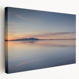 Stretched canvas wall art showcasing a serene seascape design with vibrant blues and soft whites, perfect for coastal home decor. Ideal for creating a calming atmosphere.
