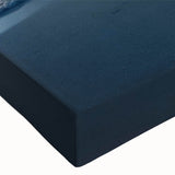 Close-up of a stretched canvas wall art piece featuring a vibrant seascape design with rich blues and greens, highlighting the intricate texture and brushstrokes. Ideal for coastal decor enthusiasts seeking to enhance their living spaces with ocean-inspired art.