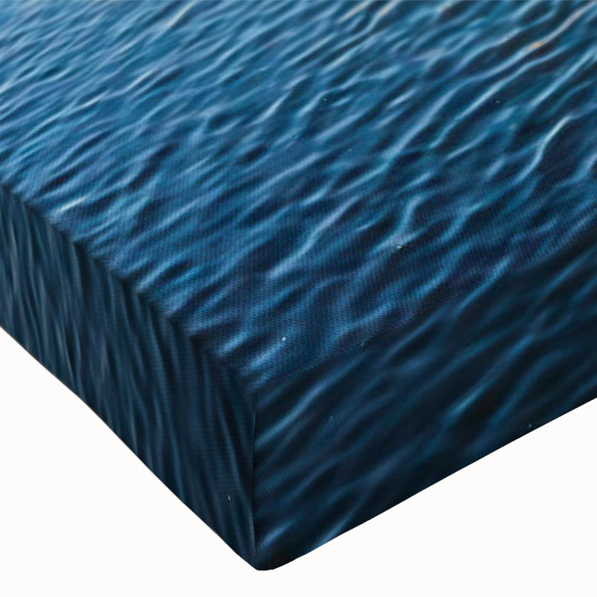 Close-up of a vibrant stretched canvas wall art piece showcasing an abstract seascape design with rich blues and greens, perfect for enhancing modern decor.