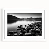 Framed wall art showcasing a serene seascape design with soft blue and white tones, featuring a white mat and sleek frame, perfect for coastal decor.