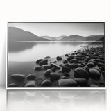 Framed wall art featuring a serene seascape design with vibrant blues and greens, presented in a sleek white frame, ideal for enhancing coastal decor.