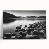 Stretched canvas wall art showcasing a serene seascape design with soft blue and green hues, elegantly leaning against a wall for a modern coastal decor accent.