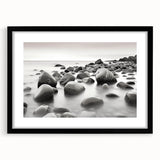 Framed wall art from the Landscapes & Seascapes collection, showcasing a serene ocean view with vibrant colors, set in a sleek black frame with a mat.