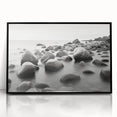Framed acrylic wall art showcasing a serene seascape with soft blue and white tones, elegantly presented in a sleek black frame, perfect for modern home decor.