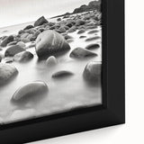 Close-up of a framed canvas artwork showcasing a serene seascape design with vibrant blues and soft whites, perfect for enhancing coastal home decor.