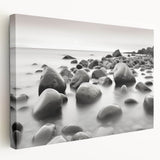 Stretched canvas wall art showcasing a serene seascape design with vibrant blues and soft whites, elegantly framed and ready to enhance modern interiors.