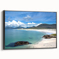 Framed canvas wall art showcasing a vibrant seascape design with calming blues and greens, set in a sleek black frame, perfect for modern home decor.