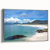 Framed canvas wall art featuring a serene seascape design, showcasing vibrant blues and soft white waves, elegantly displayed with a silver frame for a modern touch.