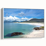 Framed canvas wall art showcasing a serene seascape design with soft blue and white hues, perfect for coastal-themed home decor. The artwork is presented in a sleek white frame, enhancing its modern aesthetic and adding elegance to any living space.