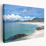 Stretched canvas wall art showcasing a serene seascape design with vibrant blues and soft whites, perfect for coastal-themed decor. Ideal for living spaces.