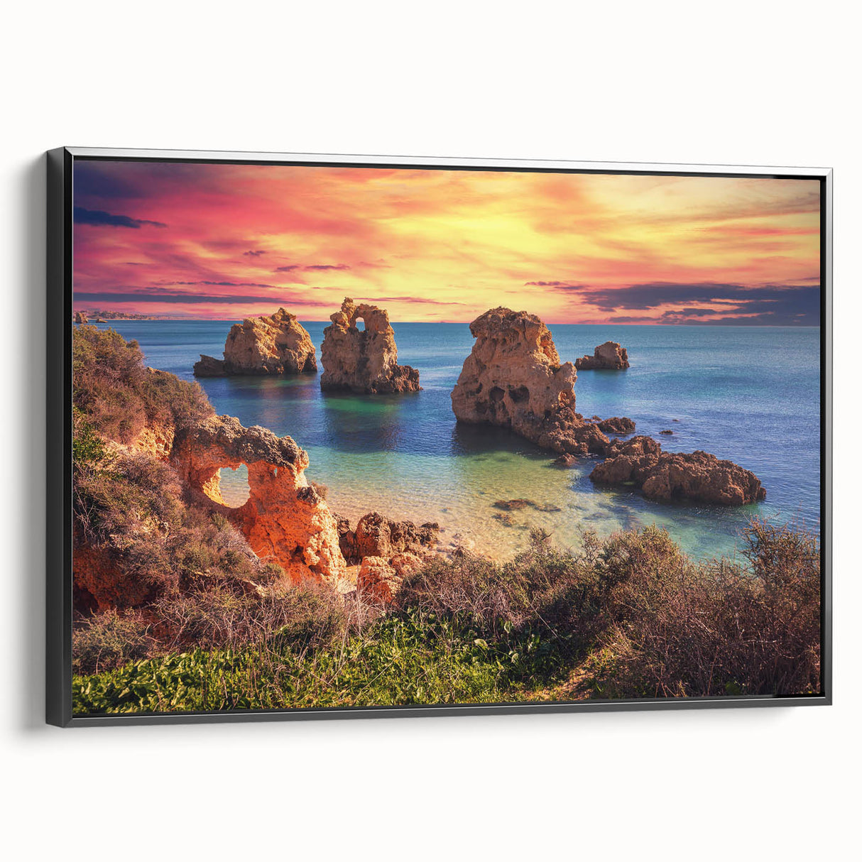 Framed canvas wall art displaying a serene seascape design, featuring soft blues and whites, with a sleek black frame, perfect for coastal-themed interiors.