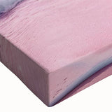 Close-up of a vibrant stretched canvas wall art piece showcasing a serene seascape design with rich blues and greens, perfect for enhancing coastal-themed decor.