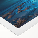 Rolled canvas art showcasing a vibrant seascape design with rich blues and greens, perfect for home decor. Packaged securely in a durable cardboard tube for safe delivery.