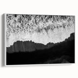 Framed canvas wall art collection showcasing a serene seascape design with soft blue and white hues, elegantly displayed from a side view to highlight its modern aesthetic.