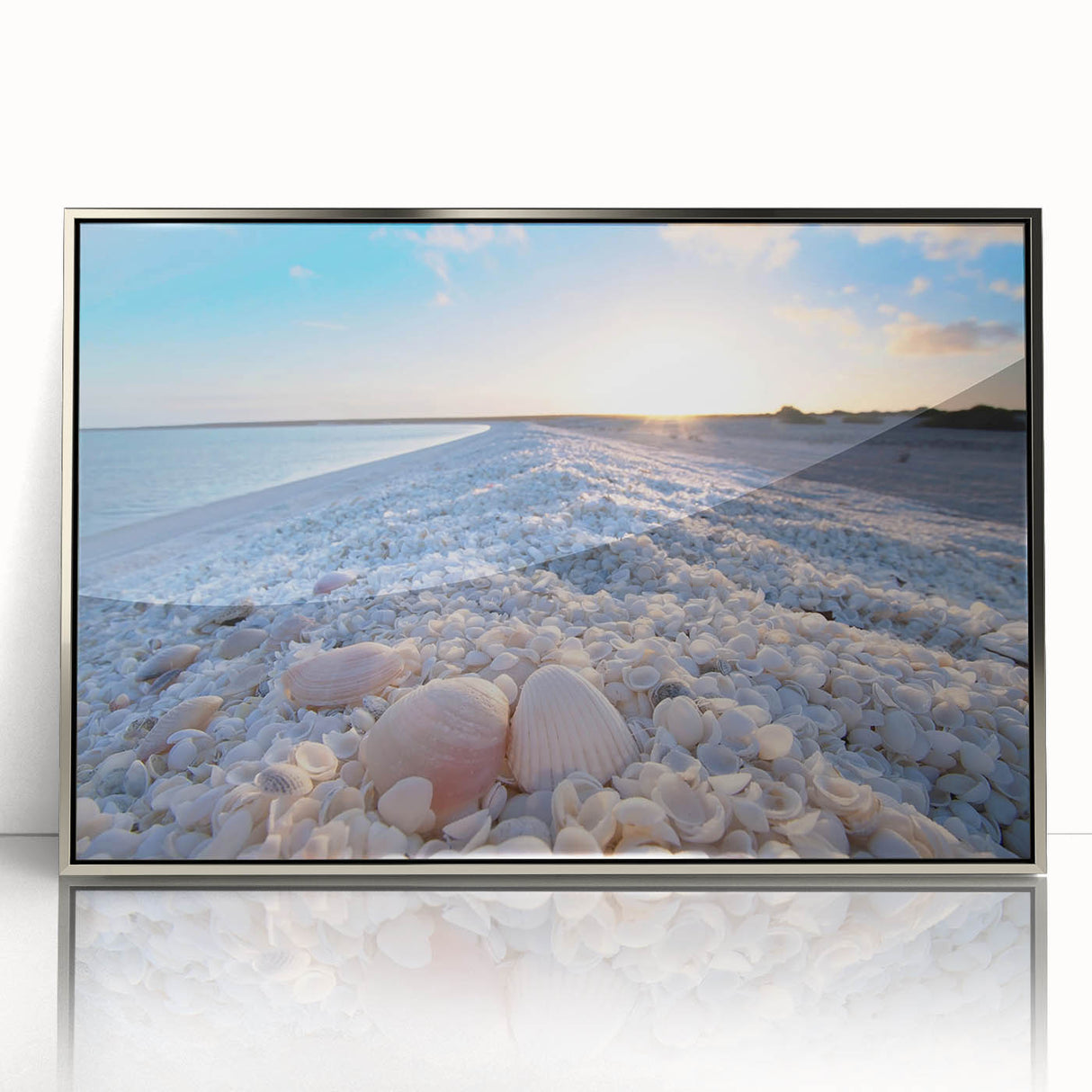 Framed acrylic wall art featuring a serene landscape and seascape design, showcased in sleek silver framing, enhancing contemporary decor with its vibrant colors and tranquil imagery. Perfect for modern home aesthetics.